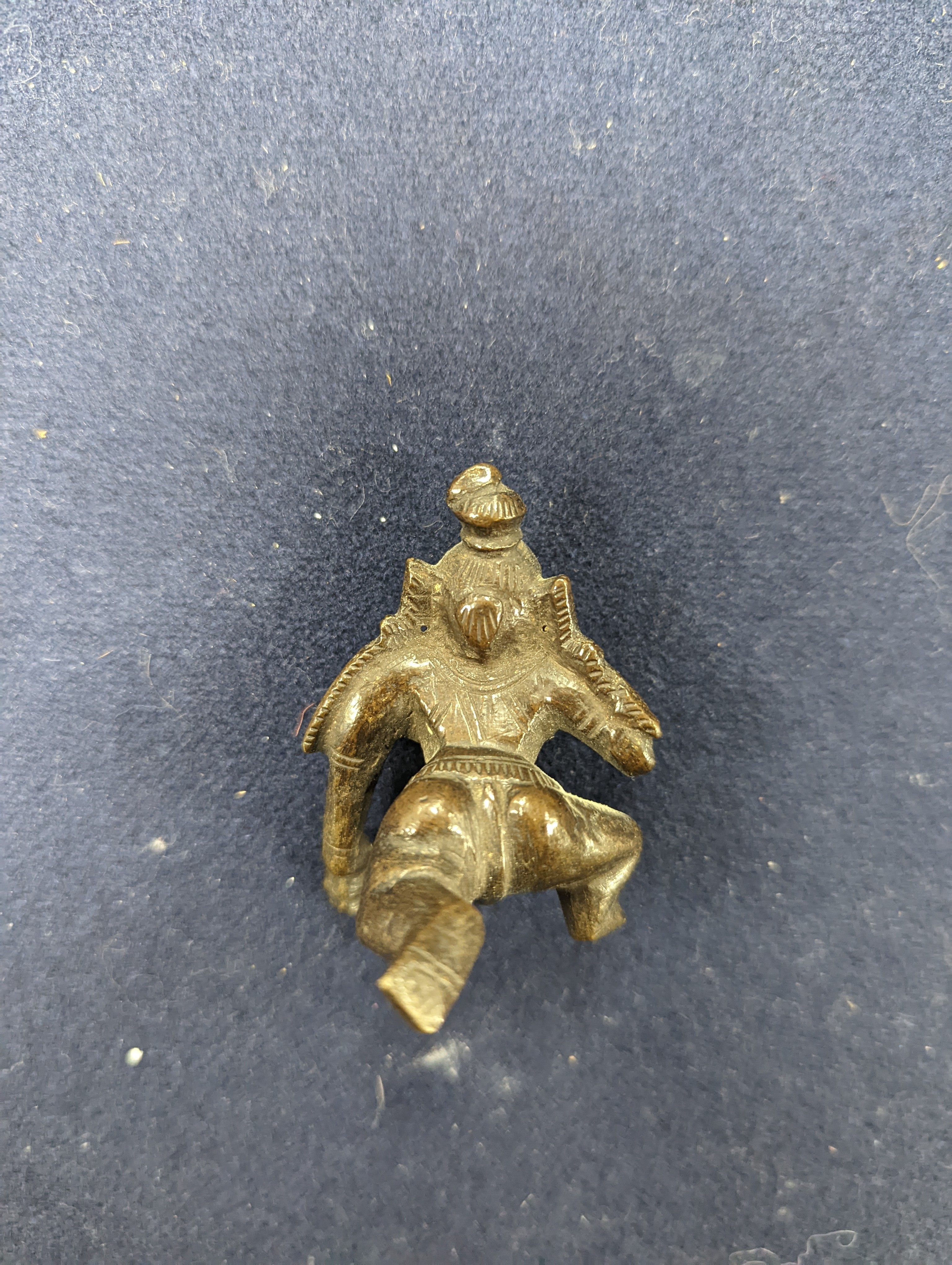 A Chinese gilt copper figure, a Chinese Dog of Fo, a bell, a censer, six Indian bronze figures and a scroll box